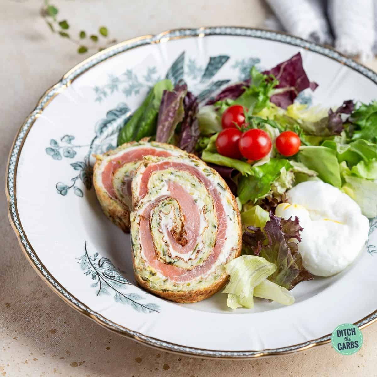 rolled smoked salmon roulade served with salad