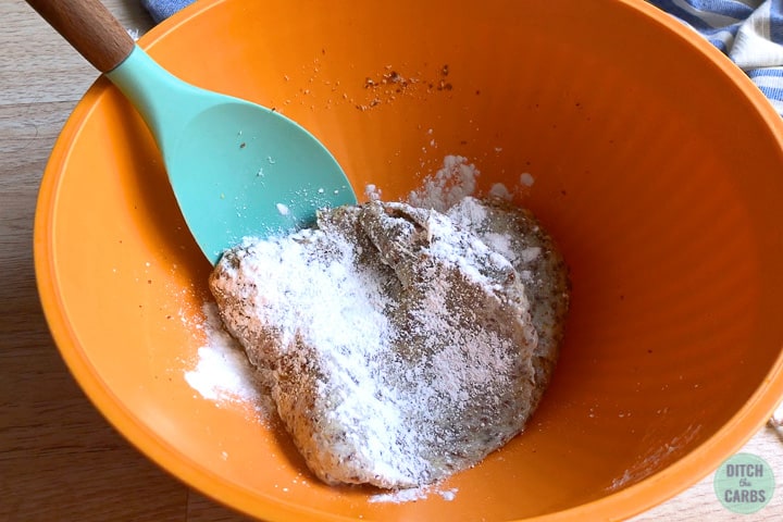 Folding baking powder into mozzarella dough.