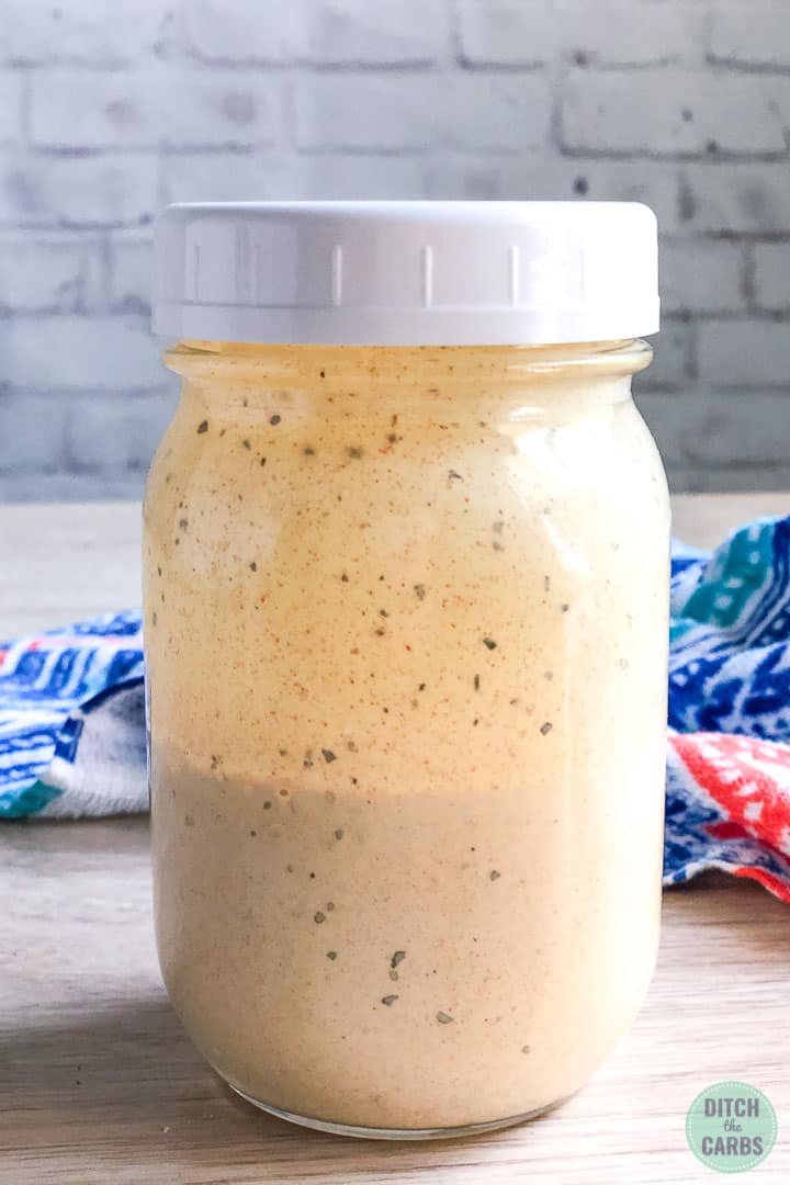 Copycat Big Mac dressing in a jar with a white lid ready to chill in the refrigerator.
