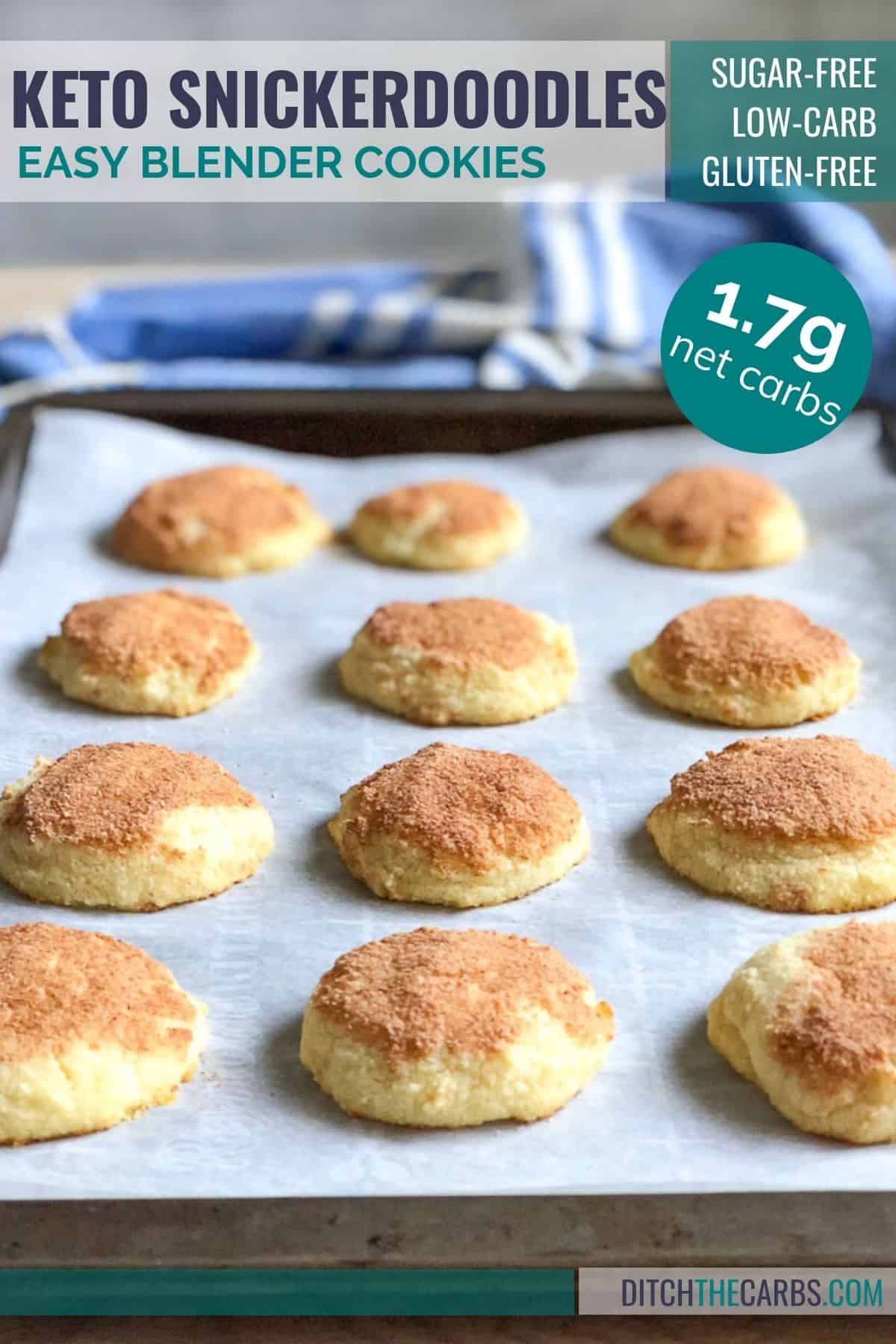 Keto snickerdoodle cookies resting on a metal cookie sheet lined with white parchment paper.