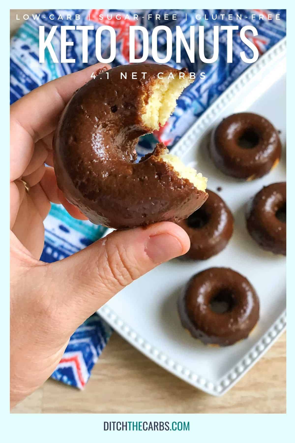 hand holding a keto donut with a bite taken