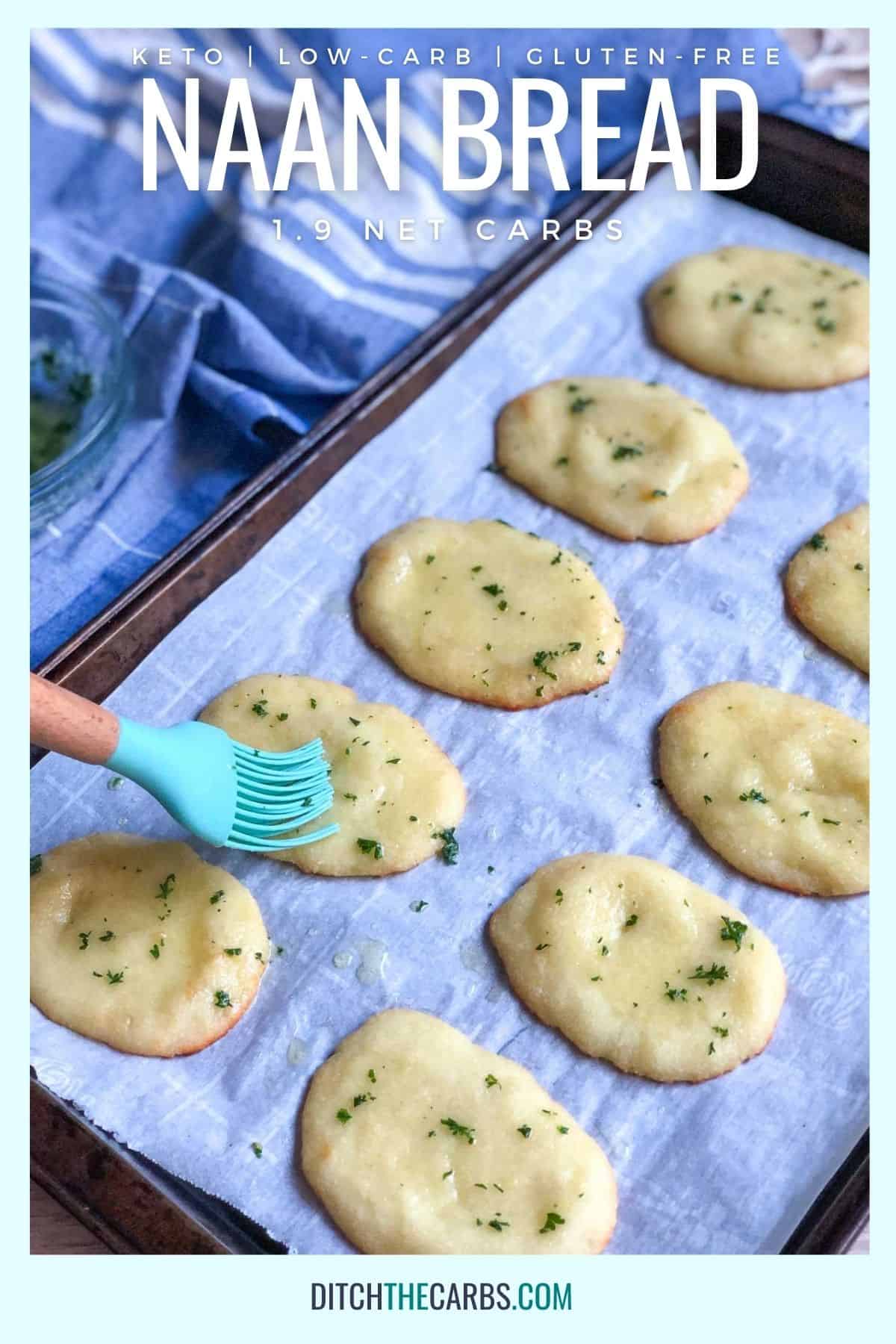 Brushing homemade naan with garlic butter and fresh parsley 