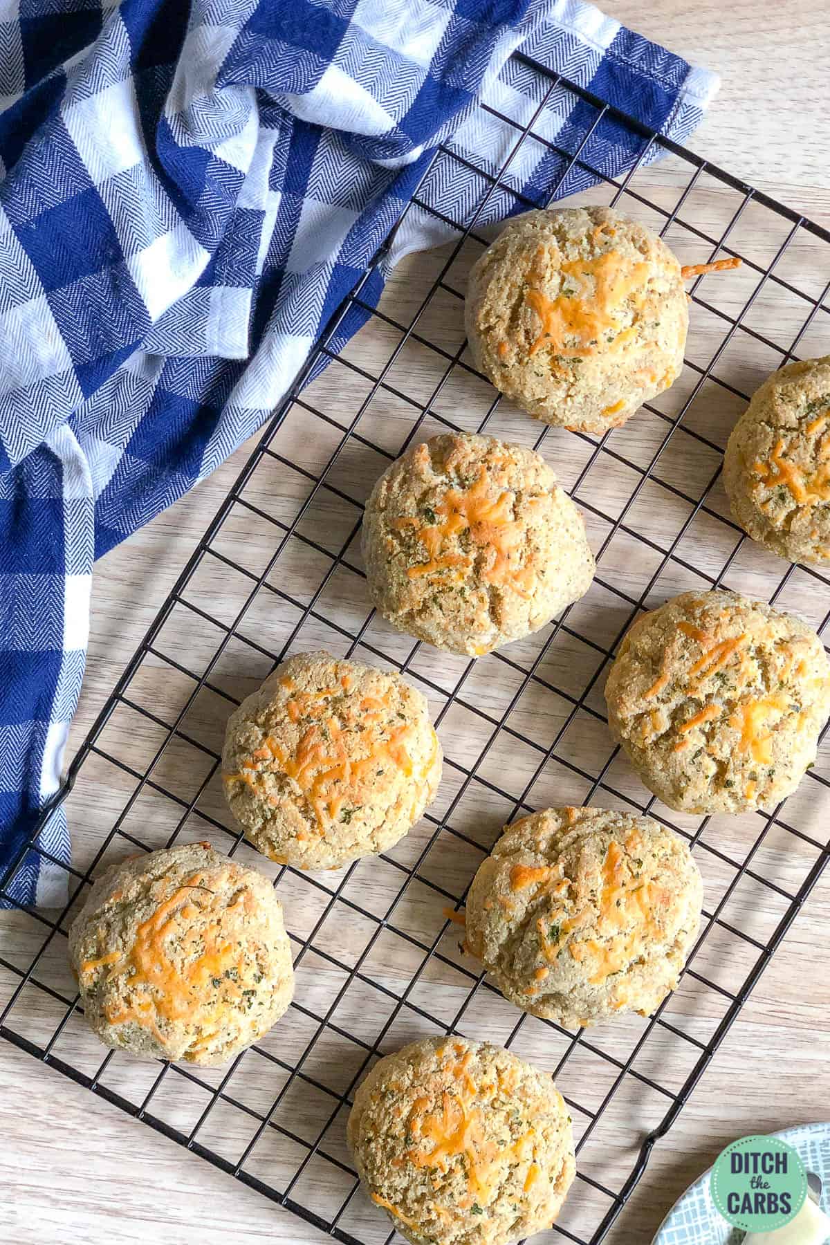Keto cheddar biscuits(scones) cooling on a wire rack.