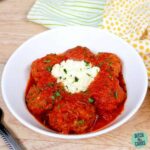 Easy Low-Carb Instant Pot Meatballs served with sour cream in a white bowl