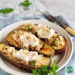A plate of baked eggplant with sour cream and with cauliflower couscous