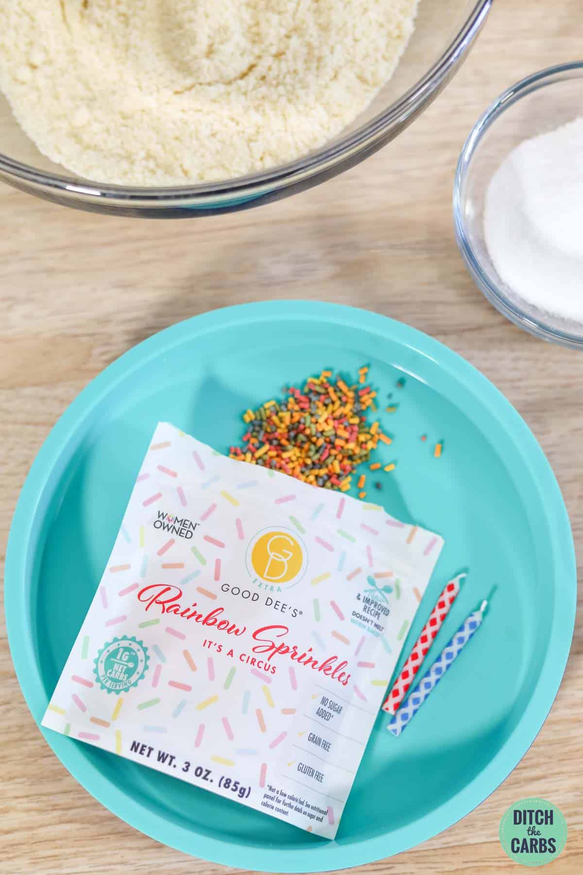 a blue plate with sugar-free sprinkles in a packet