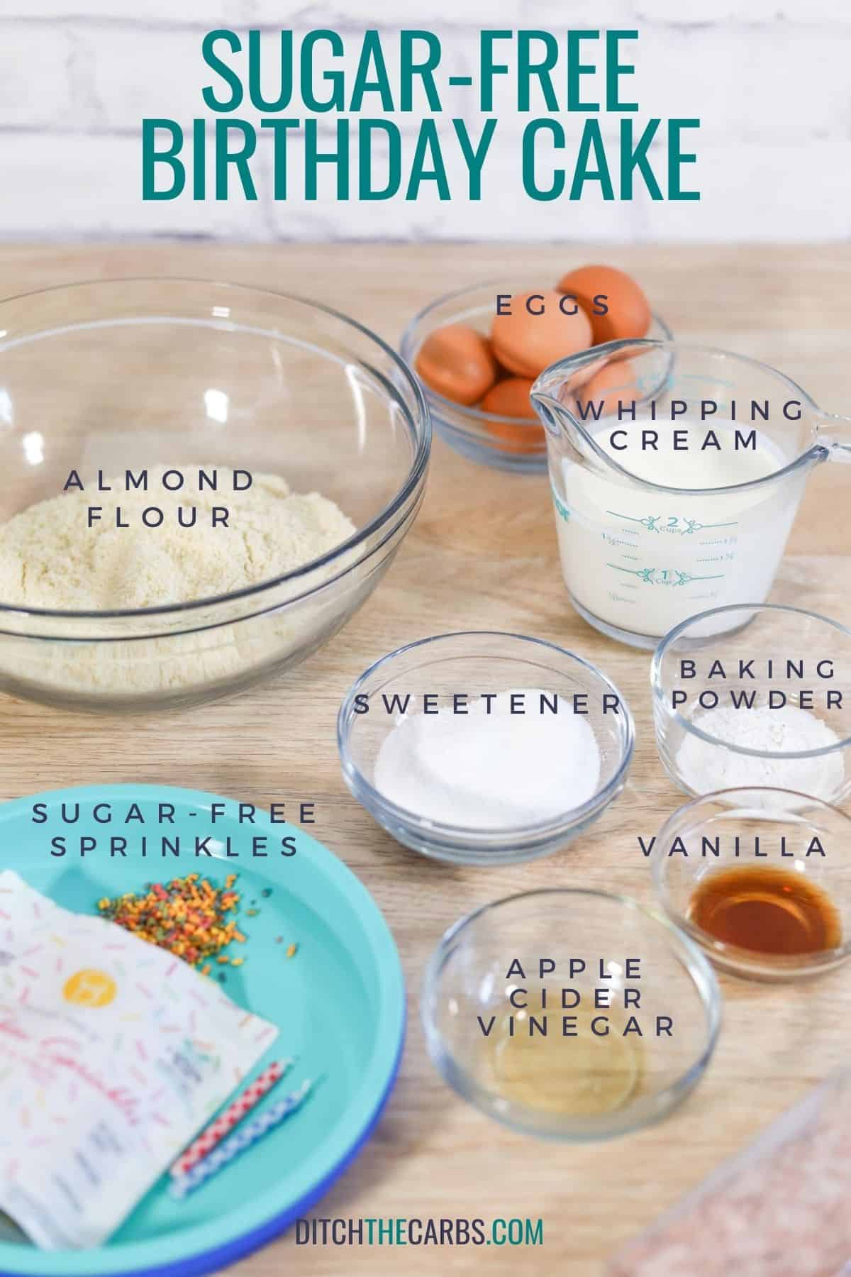 Ingredients needed to make sugar-free birthday cake measured and in bowls on the counter.