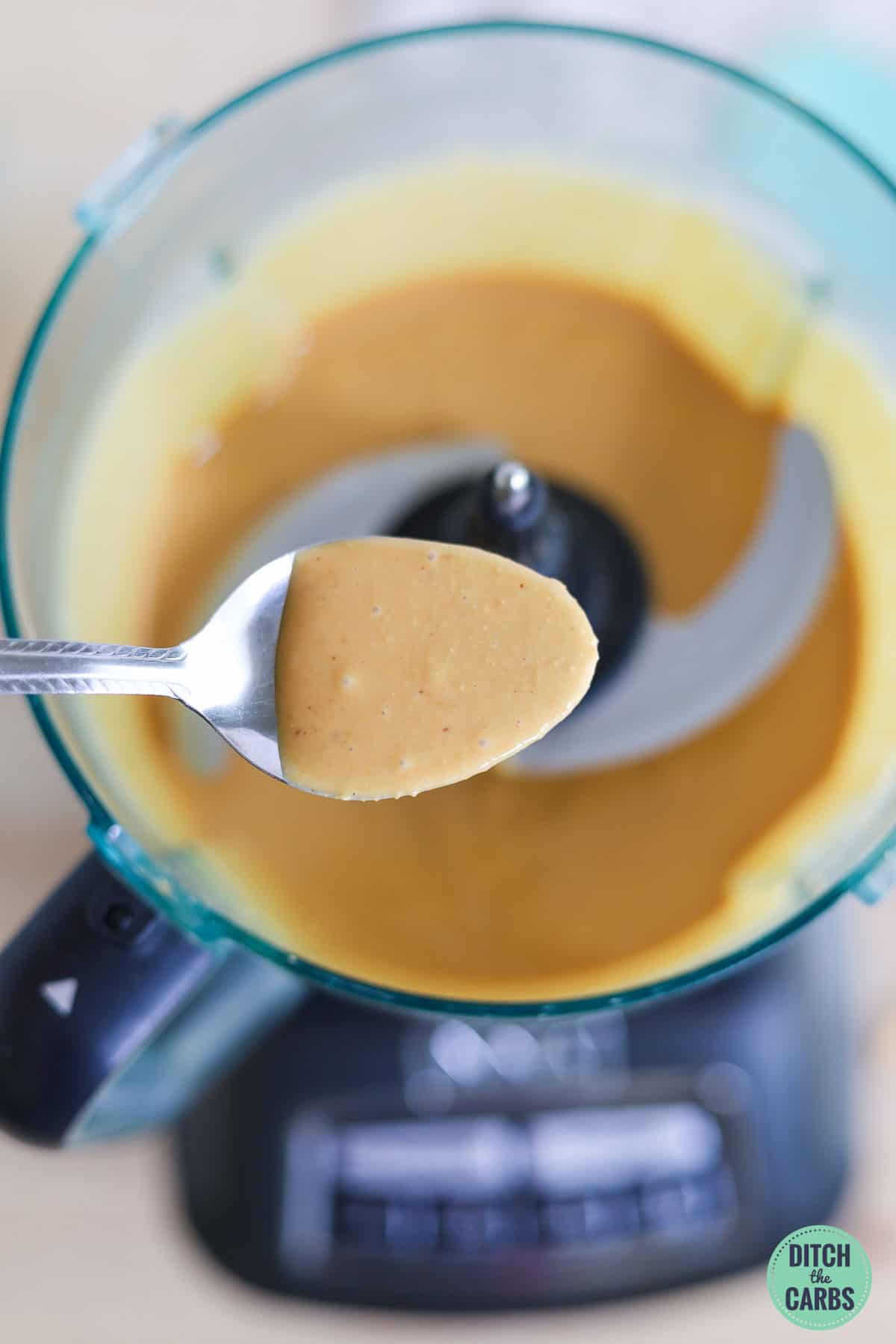 creamy peanut butter on a spoon