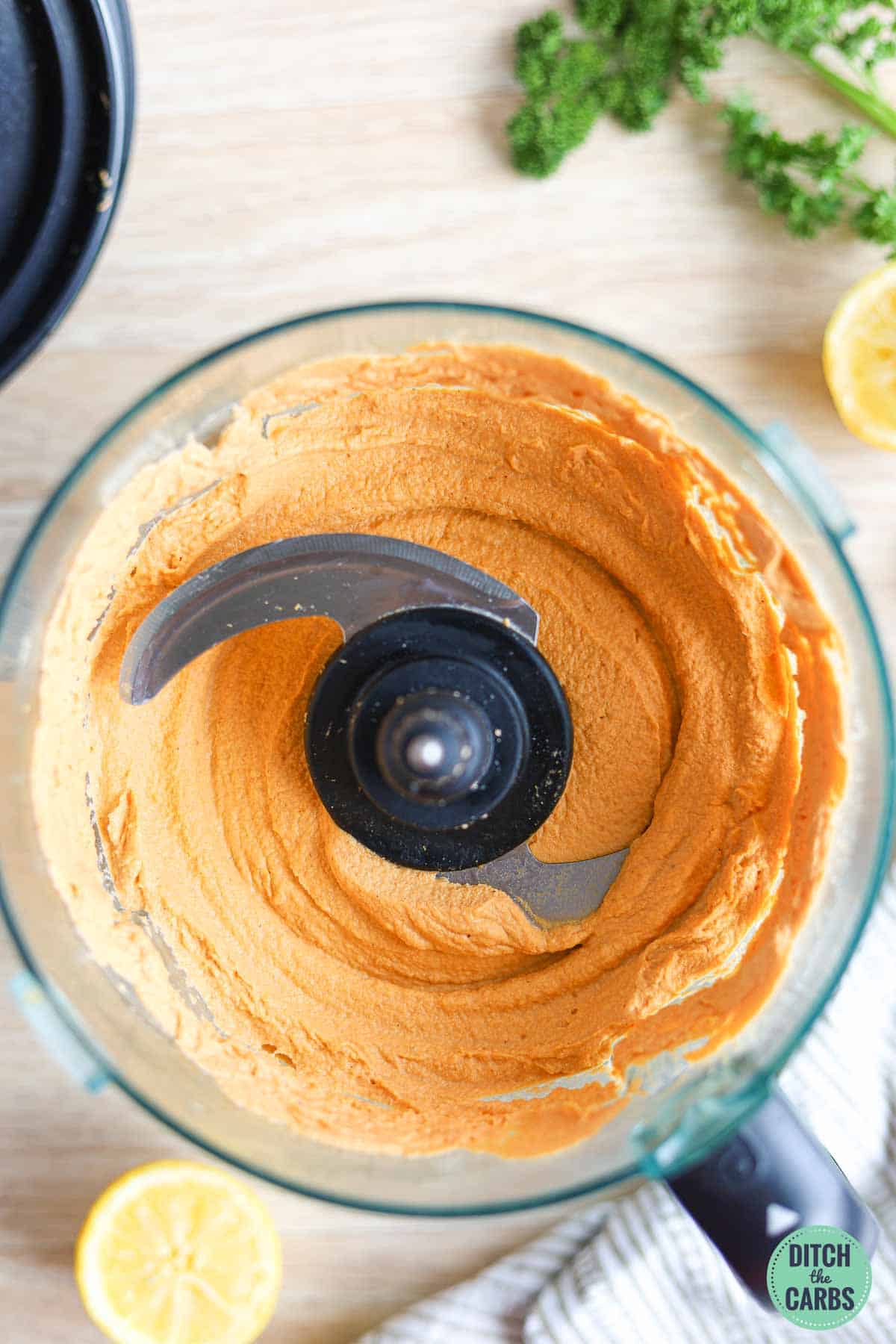 Smooth and creamy low-carb hummus mixed in a food processor.